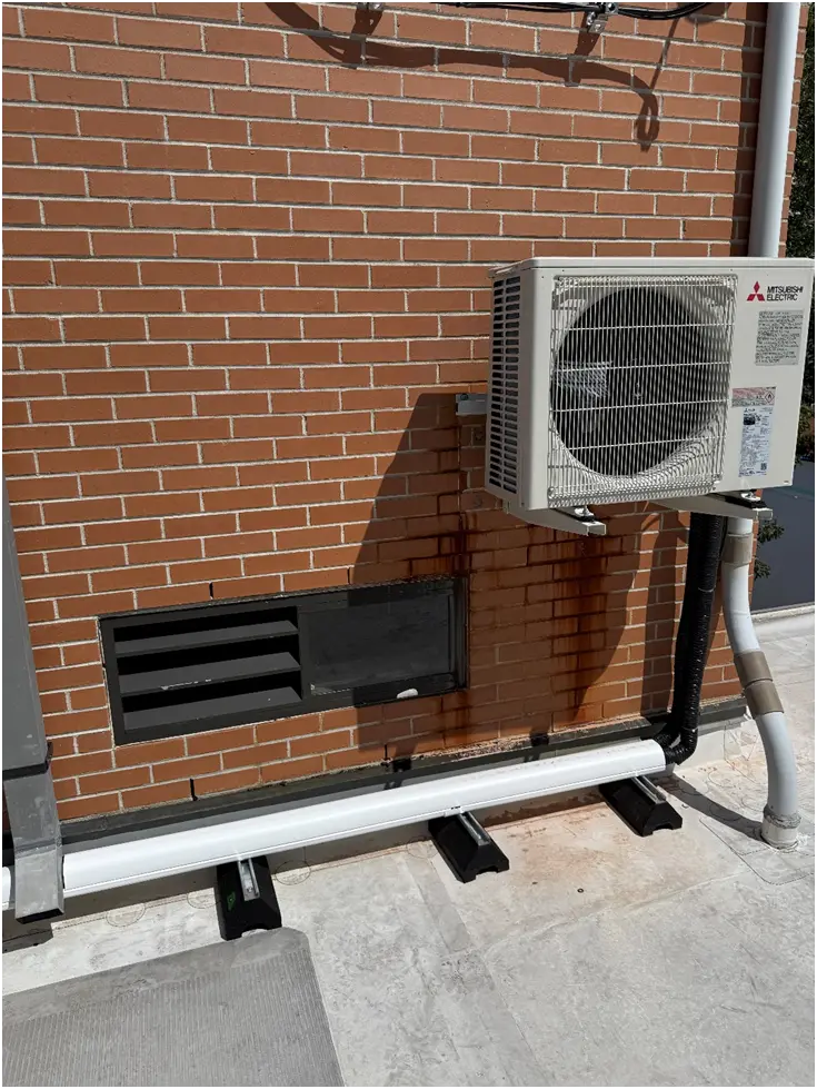 Roof-mounted split-system condenser supporting the Elevator Machine Room cooling system